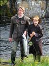 Alfie Idiens and David Holmes with Alfie`s first ever salmon